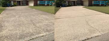 Before and after of a dirty driveway cleaned with pressure washing