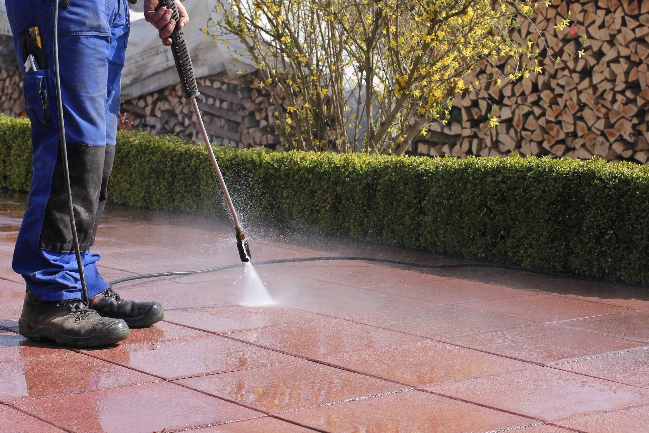 Pressure washing pavers to clean dirt and moss in Oklahoma City